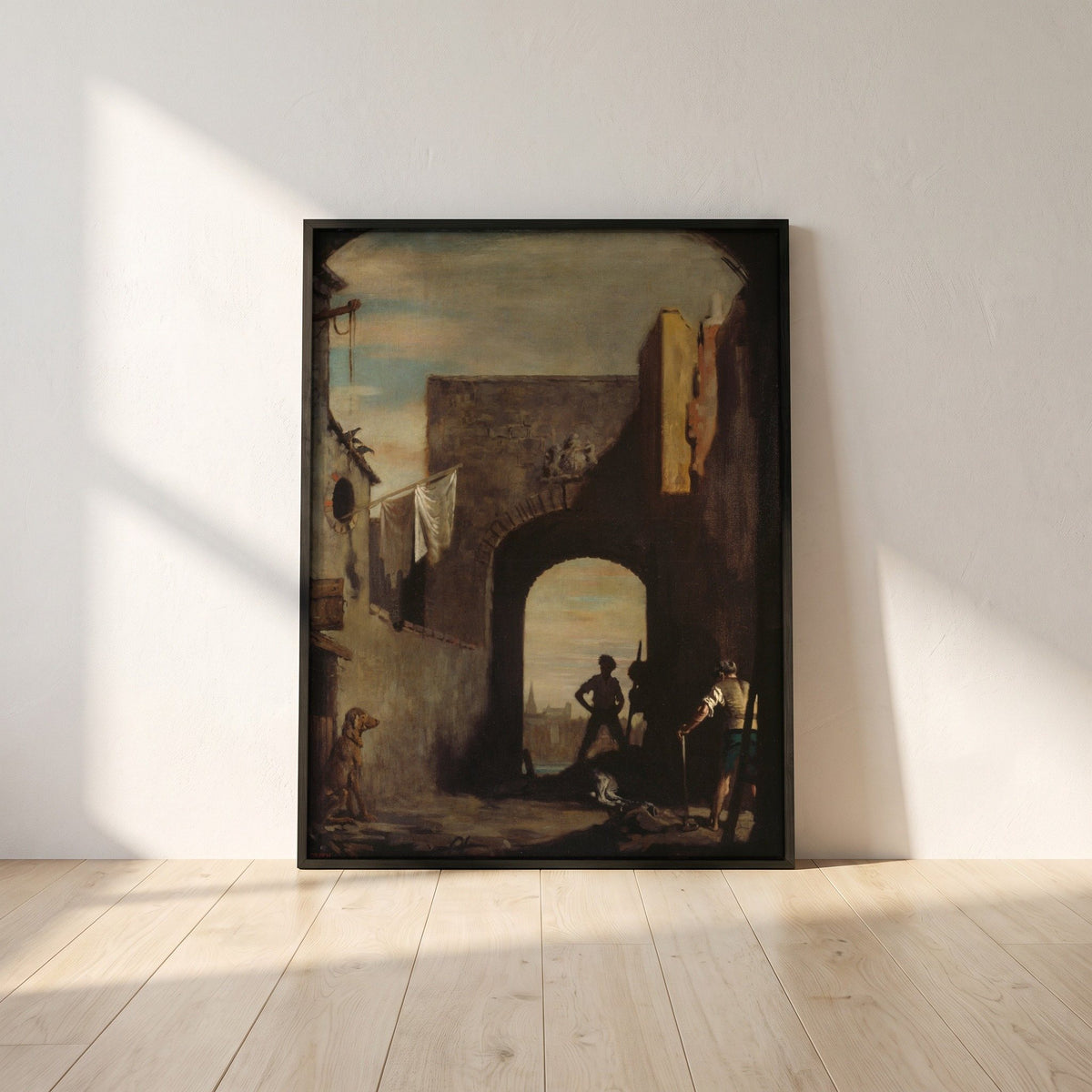 The Knacker's Yard framed print in a black frame leaning against a white plaster wall on oak floorboards in morning light
