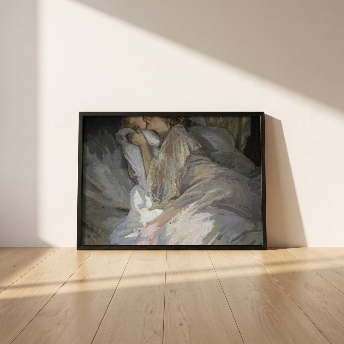 The Mother framed print in a black frame leaning against a white plaster wall on oak floorboards in morning light