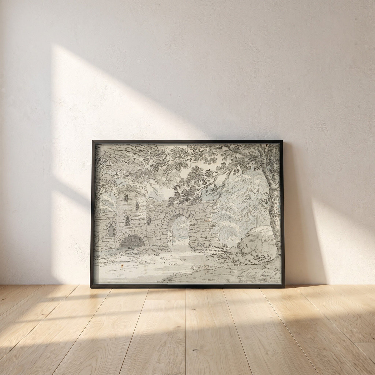 The Rustic Arch, Luttrelstown Castle framed print in a black frame leaning against a white plaster wall on oak floorboards in morning light