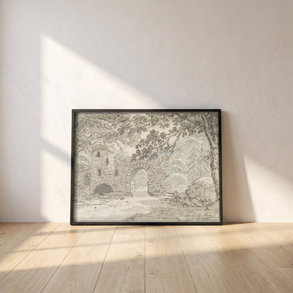 The Rustic Arch, Luttrelstown Castle framed print in a black frame leaning against a white plaster wall on oak floorboards in morning light