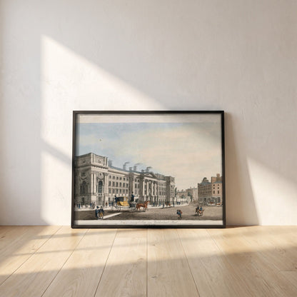 Trinity College Dublin from Westmoreland Street framed print in a black frame leaning against a white plaster wall on oak floorboards in morning light