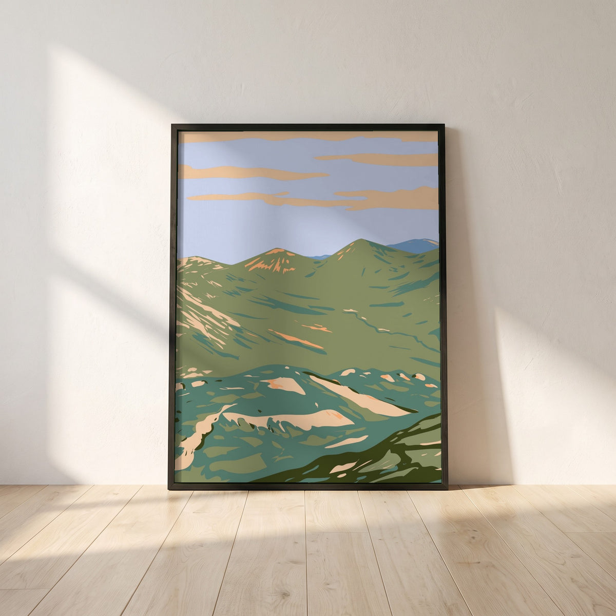 Twelve Bens Connemara National Park Galway Ireland framed print in a black frame leaning against a white plaster wall on oak floorboards in morning light