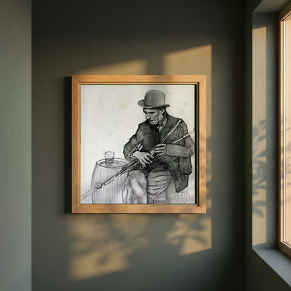 Uilleann Piper framed print in a natural oak frame on a dark green wall beside a window, dappled plant shadow