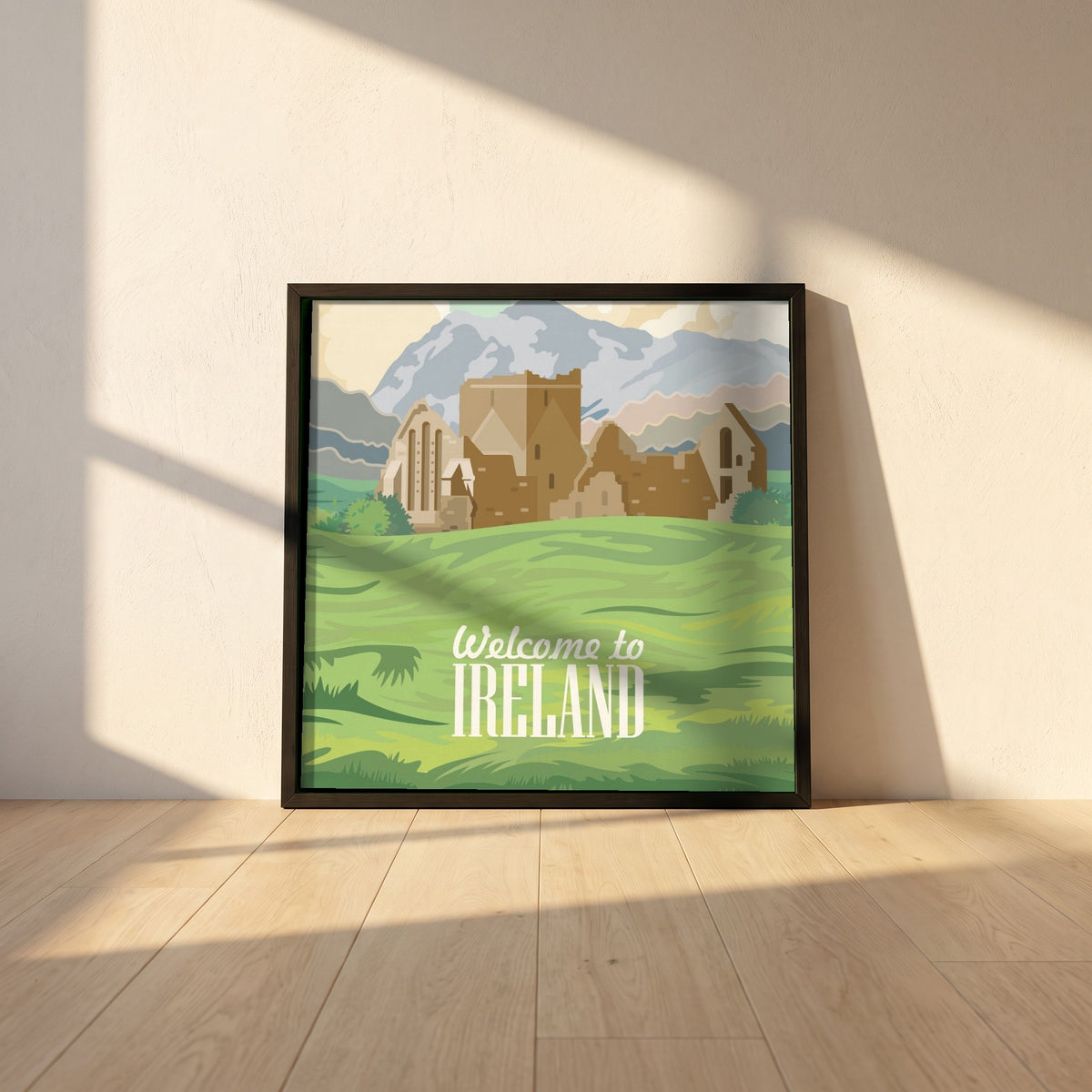Welcome to Ireland Poster Print | Vintage Irish Travel framed print in a black frame leaning against a white plaster wall on oak floorboards in morning light