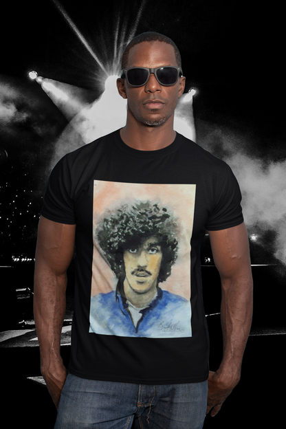 Phil Lynott tribute T-shirt: Black, featuring iconic Thin Lizzy frontman graphic. Comfortable, durable fabric, perfect for rock music lovers and fans. Ideal gift or unique wardrobe addition. Celebrate Irish rock heritage and Phil Lynott's legendary style.